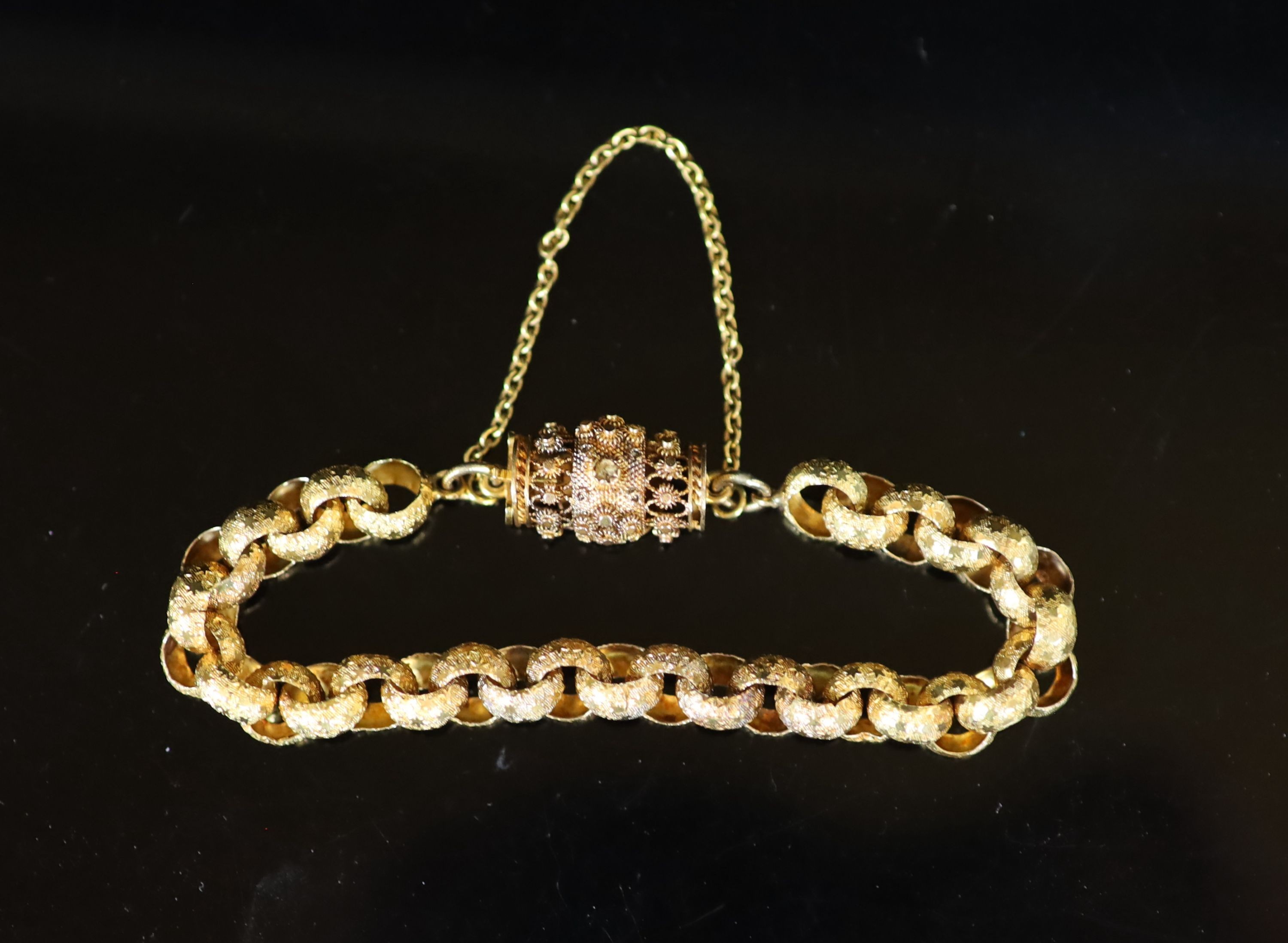 A 19th century star engraved belcher link bracelet, with pierced cannettile work, barrel shaped clasp
